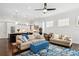 Open-concept living space featuring kitchen with island and hardwood floors, seamlessly connects to the dining and living areas at 528 Greely St, Orlando, FL 32804