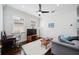Comfortable home office or den with hardwood floors, ample natural light, and a modern ceiling fan at 528 Greely St, Orlando, FL 32804