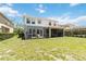 Expansive backyard with a screened in patio at 530 Harriswood Ct, Davenport, FL 33837