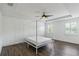 A spacious main bedroom with a decorative ceiling and multiple windows providing natural light at 530 Harriswood Ct, Davenport, FL 33837