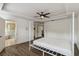 A spacious main bedroom with a decorative ceiling, and an open door to the bathroom at 530 Harriswood Ct, Davenport, FL 33837