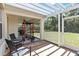 Covered patio features seating, exercise equipment, and outdoor grill at 530 Harriswood Ct, Davenport, FL 33837