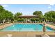 Inviting community pool with lounge chairs and umbrellas, creating a relaxing and enjoyable outdoor space at 5350 Penway Dr, Orlando, FL 32814