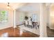 Elegant dining room featuring decorative columns, neutral tones, and a modern table set for six at 5350 Penway Dr, Orlando, FL 32814
