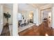 Elegant dining room featuring decorative columns, neutral tones, and a modern table set for six at 5350 Penway Dr, Orlando, FL 32814
