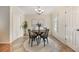 Bright, cozy dining room with modern lighting fixture and round table, ideal for intimate gatherings at 5350 Penway Dr, Orlando, FL 32814