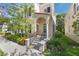 A vibrant red door and wrought iron details welcomes you to this well-maintained two-story home with lovely curb appeal at 5350 Penway Dr, Orlando, FL 32814