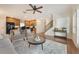 Cozy living room with a comfortable sofa, stylish chairs, and hardwood floors that create a welcoming space at 5350 Penway Dr, Orlando, FL 32814
