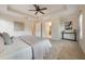 Spacious main bedroom with tray ceiling, carpet flooring, and ensuite bathroom access at 5350 Penway Dr, Orlando, FL 32814