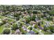 An aerial perspective reveals a neighborhood with mature trees and well-spaced houses at 543 Silver Crse, Ocala, FL 34472