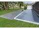 A beautiful backyard offers an open patio, a tiled walkway, and a connection to the screened lanai at 543 Silver Crse, Ocala, FL 34472