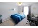 This bedroom features neutral walls and carpet, a ceiling fan, and a desk at 543 Silver Crse, Ocala, FL 34472