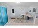 Cozy breakfast nook with a small table and seating next to a sunny window and breakfast bar at 543 Silver Crse, Ocala, FL 34472