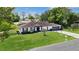 Inviting home with a well-kept lawn, a long driveway, and a convenient two-car garage at 543 Silver Crse, Ocala, FL 34472