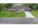 Charming single-story home featuring a well-manicured lawn and attached two-car garage at 543 Silver Crse, Ocala, FL 34472