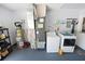 Laundry room featuring a washer and dryer, shelving, and utility sink at 543 Silver Crse, Ocala, FL 34472