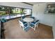 Enclosed patio space includes a seating area, and views of the backyard at 543 Silver Crse, Ocala, FL 34472