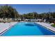 Enjoy a refreshing swim in this community's sparkling pool with lounge chairs and manicured landscaping all around at 543 Silver Crse, Ocala, FL 34472