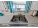 Close-up of a stainless steel double sink with updated faucet and accents at 543 Silver Crse, Ocala, FL 34472