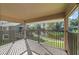 Overlooking a tranquil pond and community greenery, this balcony provides a serene outdoor retreat at 6120 Peregrine Ave # A08-2, Orlando, FL 32819