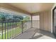 Relax on the balcony overlooking the scenic pond and the beautiful lush greenery of the community at 6120 Peregrine Ave # A08-2, Orlando, FL 32819