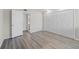 This bedroom offers neutral walls, modern gray flooring, and a spacious closet for ample storage at 6120 Peregrine Ave # A08-2, Orlando, FL 32819