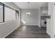Cozy dining area with updated floors, pendant lighting, and a large window at 6120 Peregrine Ave # A08-2, Orlando, FL 32819