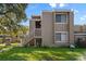 Charming two-story condo with a private entrance and well-maintained front yard at 6120 Peregrine Ave # A08-2, Orlando, FL 32819
