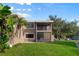 Condo featuring a private balcony and screened patio, perfect for outdoor living at 6120 Peregrine Ave # A08-2, Orlando, FL 32819