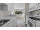 Modern kitchen featuring new appliances, ample counter space, and lots of cabinets at 6120 Peregrine Ave # A08-2, Orlando, FL 32819