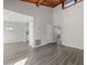 Spacious living room with lots of wall space and updated vinyl plank flooring at 6120 Peregrine Ave # A08-2, Orlando, FL 32819