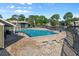 Sparkling community pool surrounded by comfortable lounge chairs and lush landscaping at 6120 Peregrine Ave # A08-2, Orlando, FL 32819