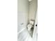 Bathroom featuring white tiled flooring, toilet, and white walls at 6449 Sw 180Th Cir, Dunnellon, FL 34432