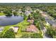 Overhead image of home with fenced-in yard on lake showing expansive green space at 700 Wyckliffe Pl, Winter Springs, FL 32708
