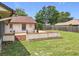 Backyard area with a raised mulched garden bed and room for outdoor seating at 700 Wyckliffe Pl, Winter Springs, FL 32708