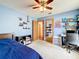 Bedroom with blue walls, ceiling fan, and desk at 700 Wyckliffe Pl, Winter Springs, FL 32708