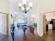 Open-concept view of the dining room and living room with hardwood floors at 700 Wyckliffe Pl, Winter Springs, FL 32708