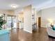 Spacious living area showcasing an open floor plan, bar seating, and sliding glass doors to the patio at 700 Wyckliffe Pl, Winter Springs, FL 32708