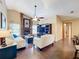 Bright living room featuring a fireplace, and an entertainment center at 700 Wyckliffe Pl, Winter Springs, FL 32708