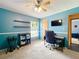 Office space offering a ceiling fan, shelving and a large window providing ample natural light at 700 Wyckliffe Pl, Winter Springs, FL 32708