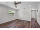 Cozy bedroom offering neutral walls, modern ceiling fan, and wood flooring at 709 Suzette Dr, Ocoee, FL 34761