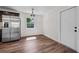 Modern kitchen with stainless steel refrigerator and sleek wood flooring at 709 Suzette Dr, Ocoee, FL 34761