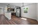 Modern kitchen with stainless steel appliances, dark cabinetry, and a breakfast bar at 709 Suzette Dr, Ocoee, FL 34761