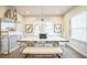 Contemporary dining room with modern chandelier and artwork at 730 Rominger Loop, Apopka, FL 32712