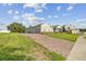 Beautiful home with brick driveway and well-maintained landscaping and large green yard at 730 Rominger Loop, Apopka, FL 32712
