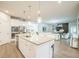 Bright open concept kitchen with granite island and stainless steel appliances at 730 Rominger Loop, Apopka, FL 32712