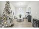 A modern living room with a designer Christmas tree in the corner at 730 Rominger Loop, Apopka, FL 32712