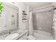 Neutral bathroom featuring granite counters, framed mirror, and shower and tub combo at 7603 Taormina Way, Clermont, FL 34714