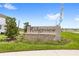 Ridgeview community entrance sign with stone accents, landscaping and blue sky at 7603 Taormina Way, Clermont, FL 34714