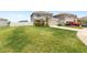 Two-story home featuring a spacious front lawn and well-manicured landscaping at 7603 Taormina Way, Clermont, FL 34714